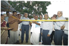 Manickam, President of Gonoor Panchayat, inaugurating the second tuition centre. Chemplast officials look on